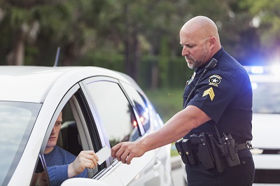 police officer giving ticket